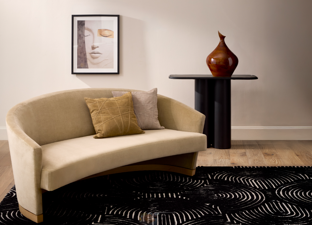 A collection of contemporary blue and white vases displayed on light wooden plinths, lit by soft window light.
